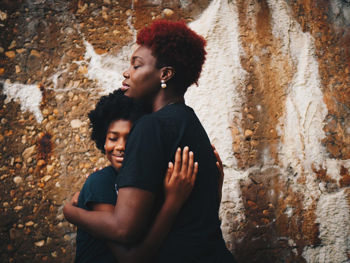 Mother and daughter embracing
